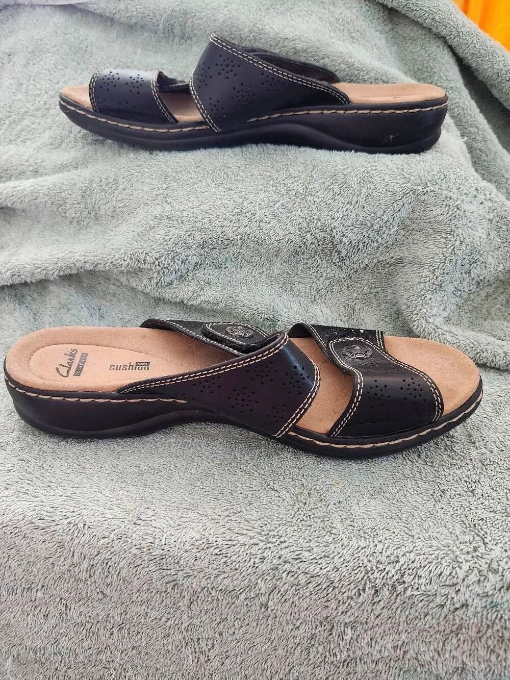 Clarks Leisa Lacole women's sandals featuring black leather straps, ornate silve